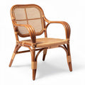 Rattan lounge chair with woven seat and backrest for indoor or outdoor use